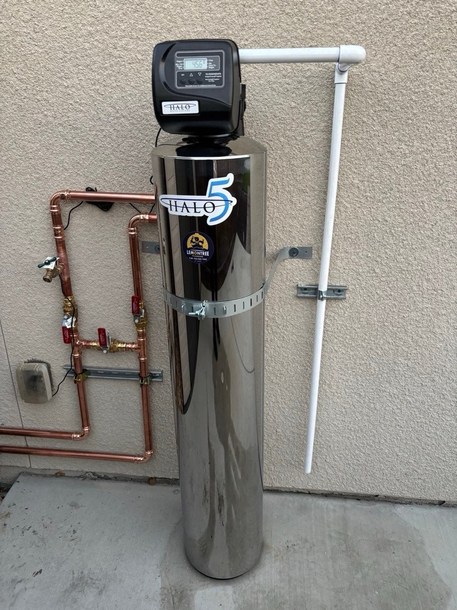 Whole-house water filtration unit with copper bypass piping