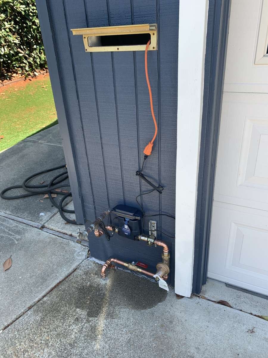 New copper water main entry with shut-off at the front of a house