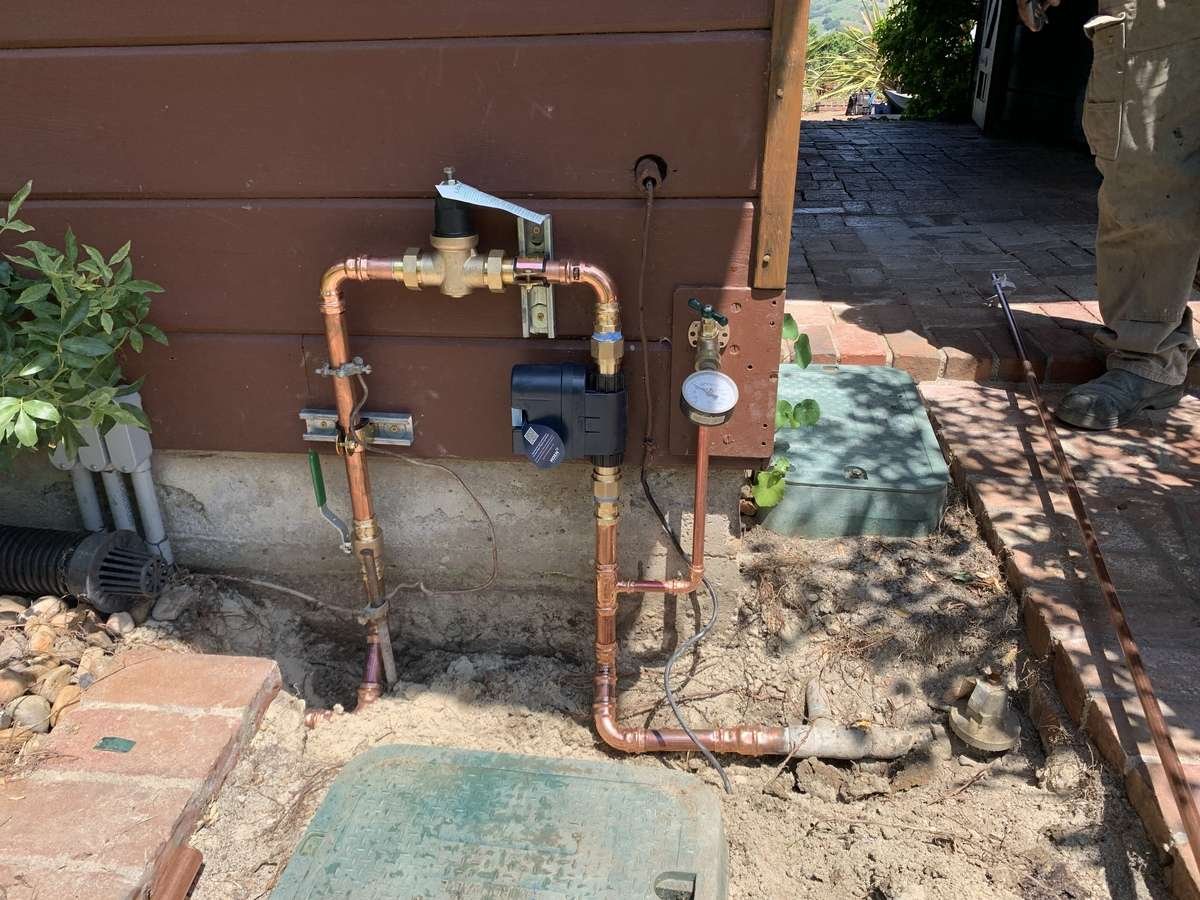 New copper main with pressure regulator and smart shut-off